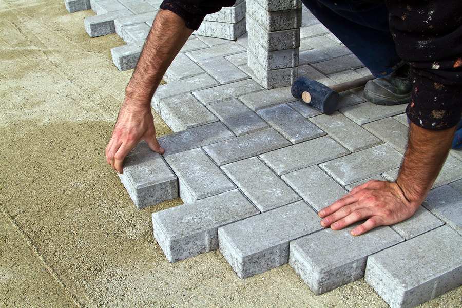 man installing a blocks